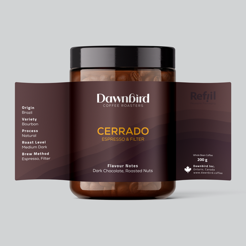 Jar of Dawnbird Coffee Roasters Cerrado coffee with label on a light gray background