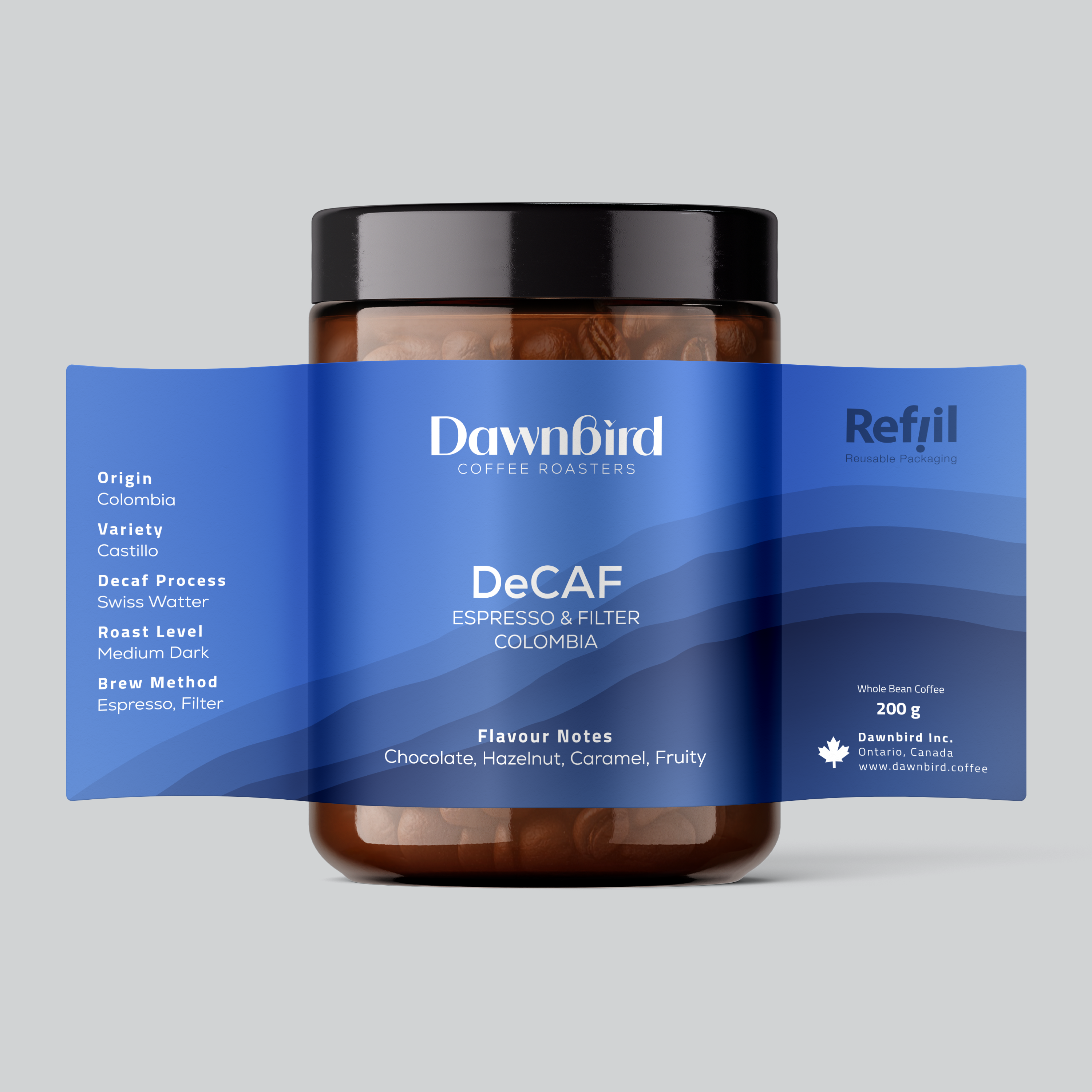 Jar of Dawnbird Coffee Roasters DeCAF coffee with blue label on a gray background
