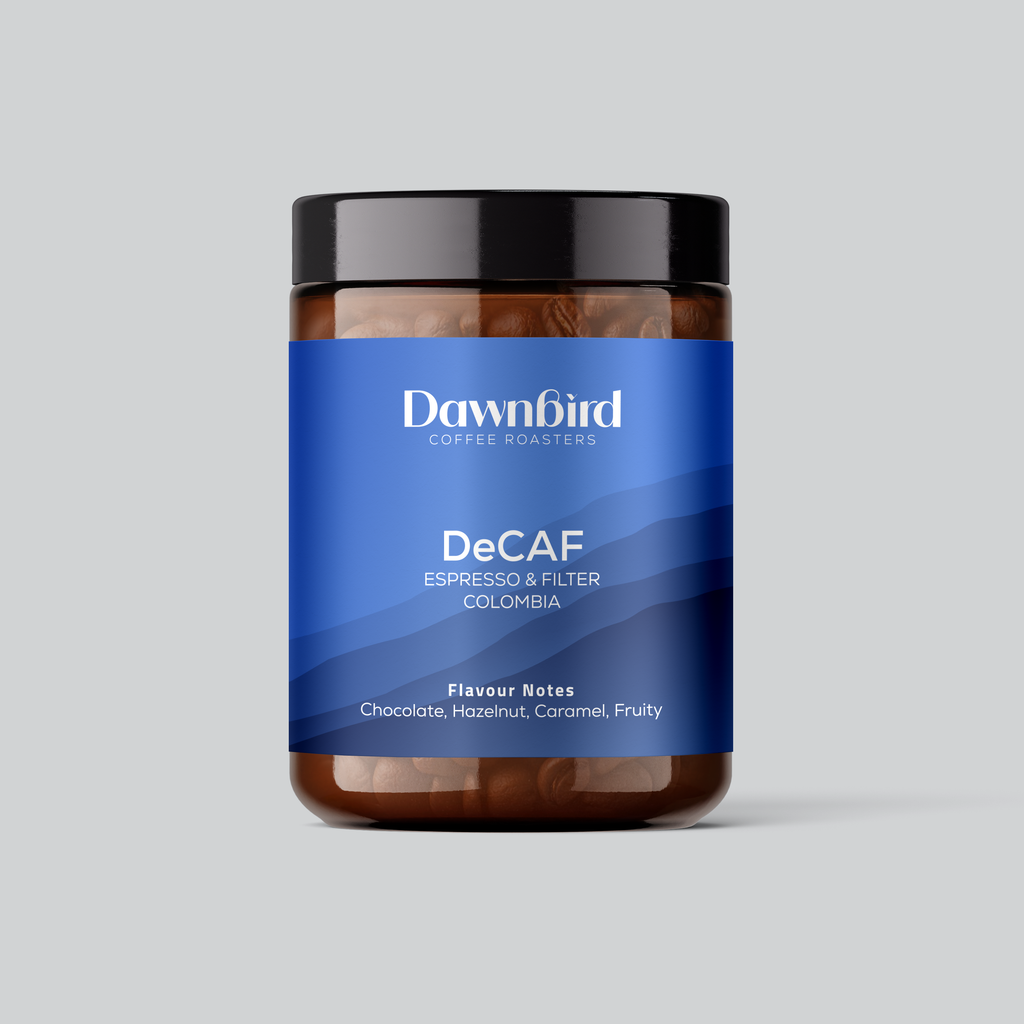 Jar of Dawnbird Coffee Roasters Decaf coffee on a gray background